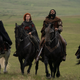 four characters on horses